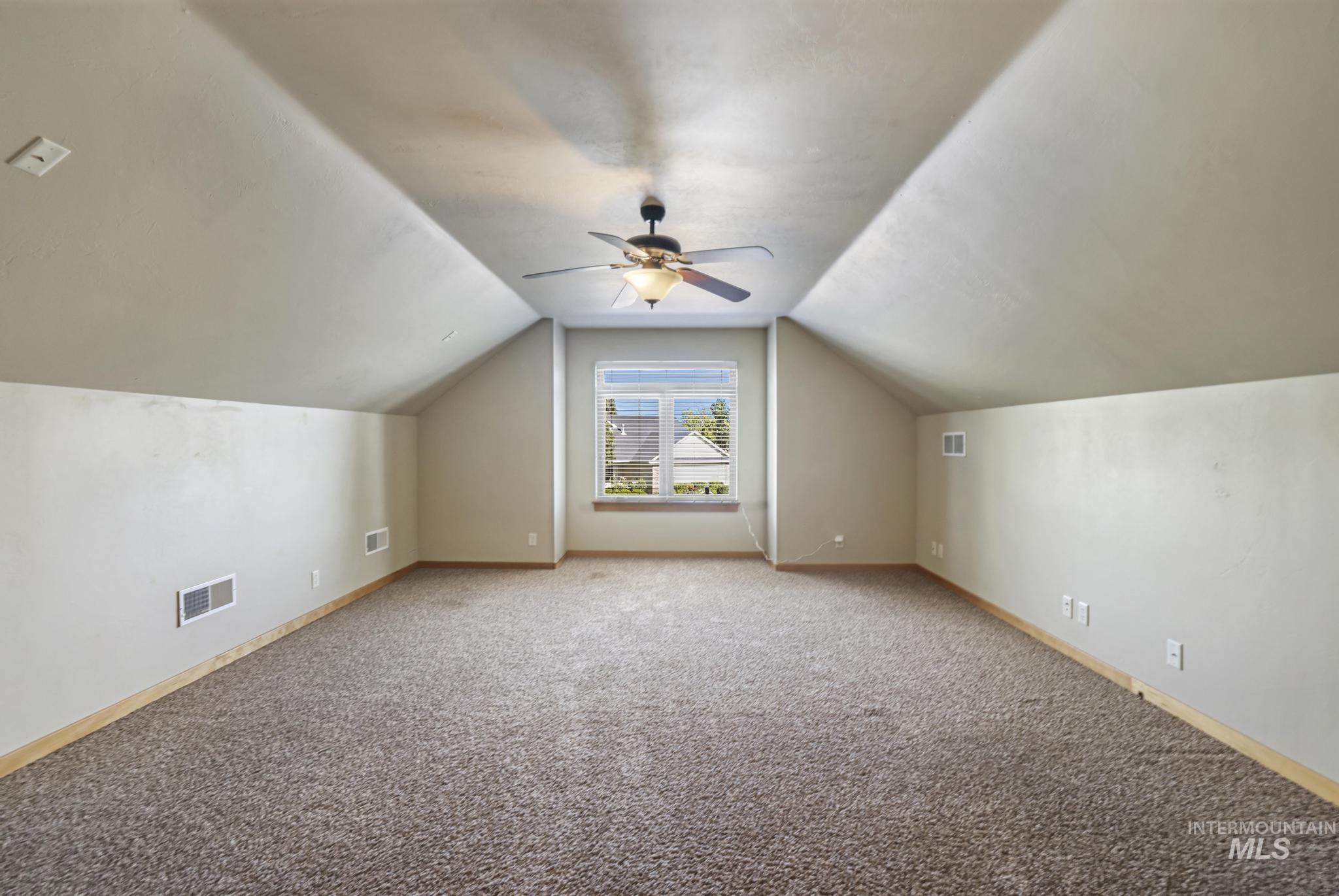 205 Edwards Drive Twin Falls, ID 83301 - Photo 34 of 49 Bonus room featuring carpet floors, lofted ceiling, and ceiling fan