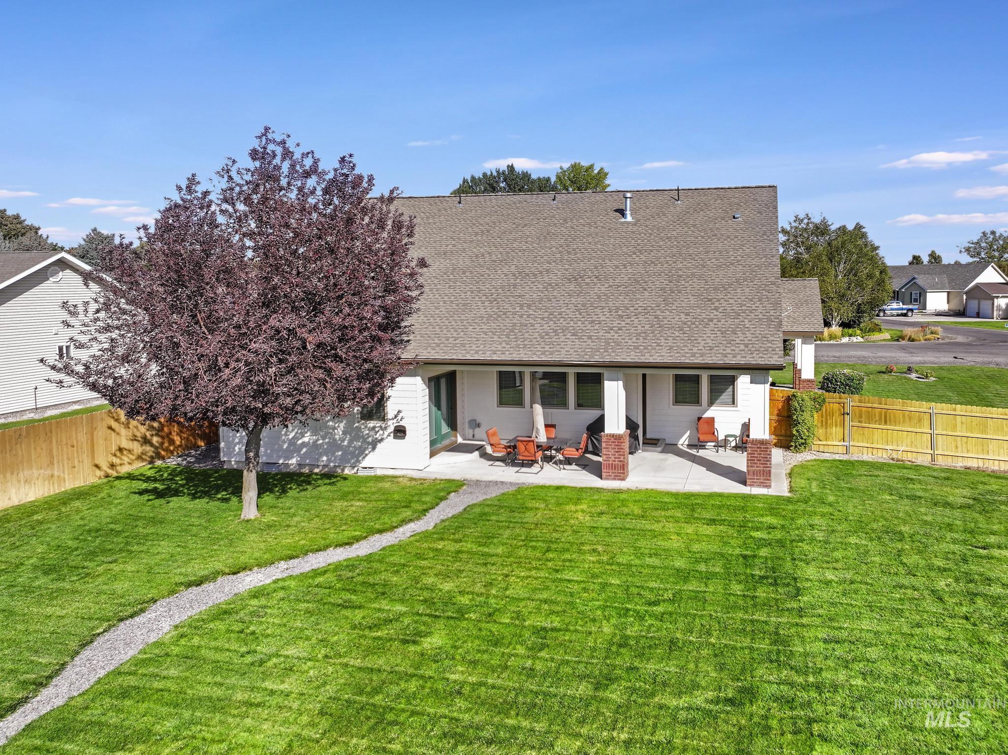 205 Edwards Drive Twin Falls, ID 83301 - Photo 37 of 49 Back of house featuring a fenced backyard, a patio area, and a shingled roof