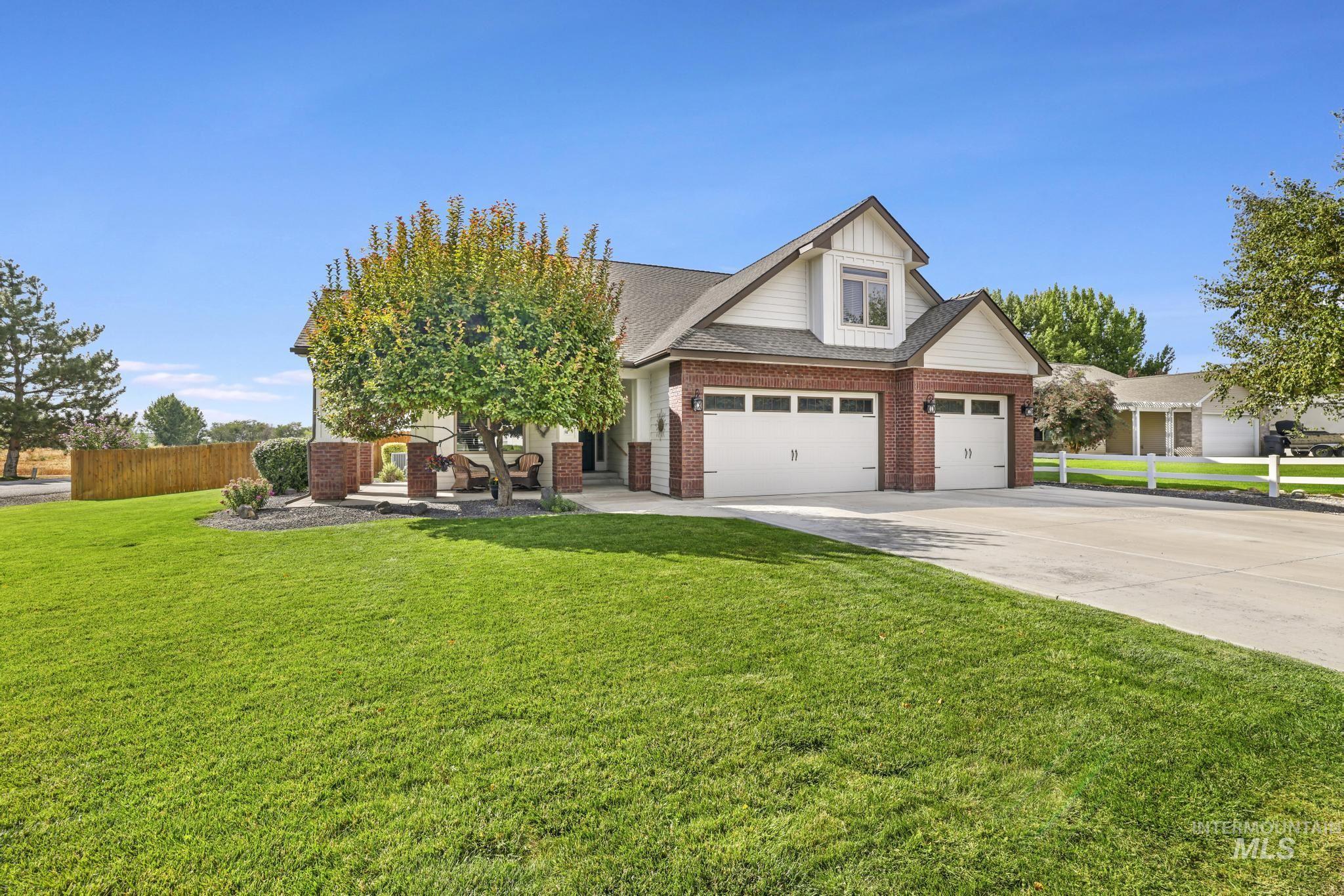 205 Edwards Drive Twin Falls, ID 83301 - Photo 4 of 49 View of front of home with concrete driveway, brick siding, and a shingled roof
