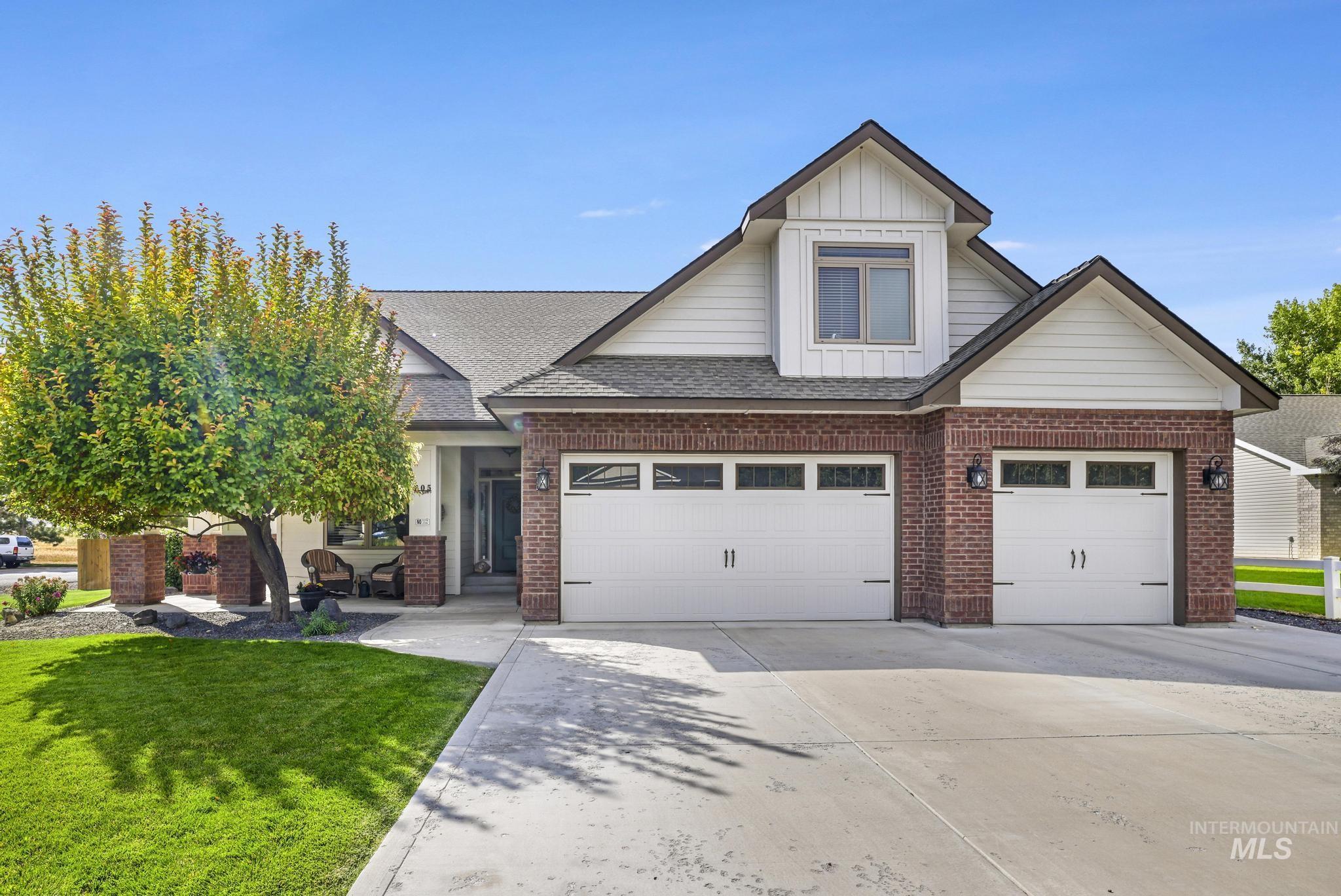 205 Edwards Drive Twin Falls, ID 83301 - Photo 48 of 49 Craftsman inspired home featuring driveway, brick siding, board and batten siding, and a shingled roof