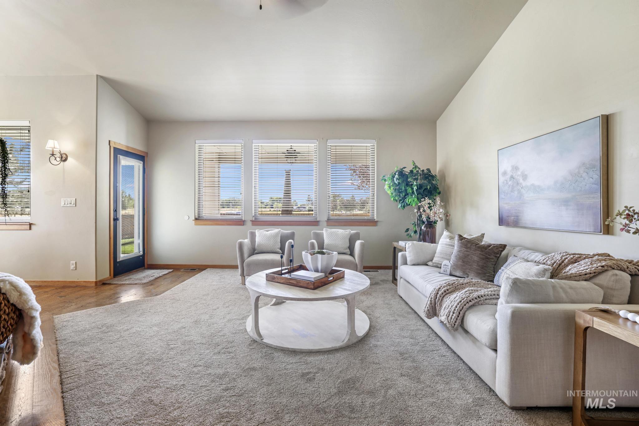 205 Edwards Drive Twin Falls, ID 83301 - Photo 10 of 49 Living area featuring baseboards and ceiling fan