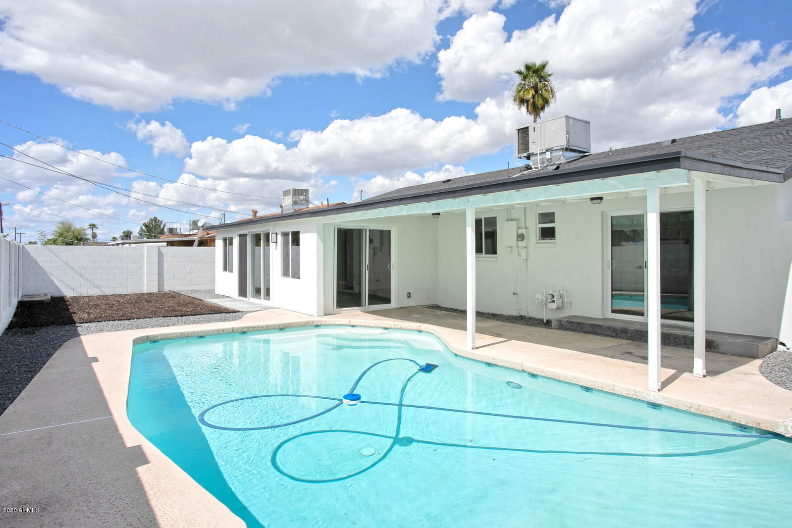 4917 East Granada Road Phoenix, AZ 85008 - Photo 18 of 18 a house view with swimming pool and dinning table and chairs