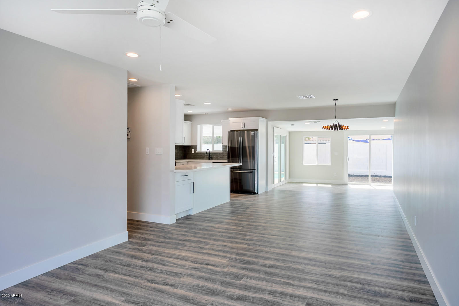 4917 East Granada Road Phoenix, AZ 85008 - Photo 2 of 18 a view of a kitchen with a refrigerator and a stove top oven