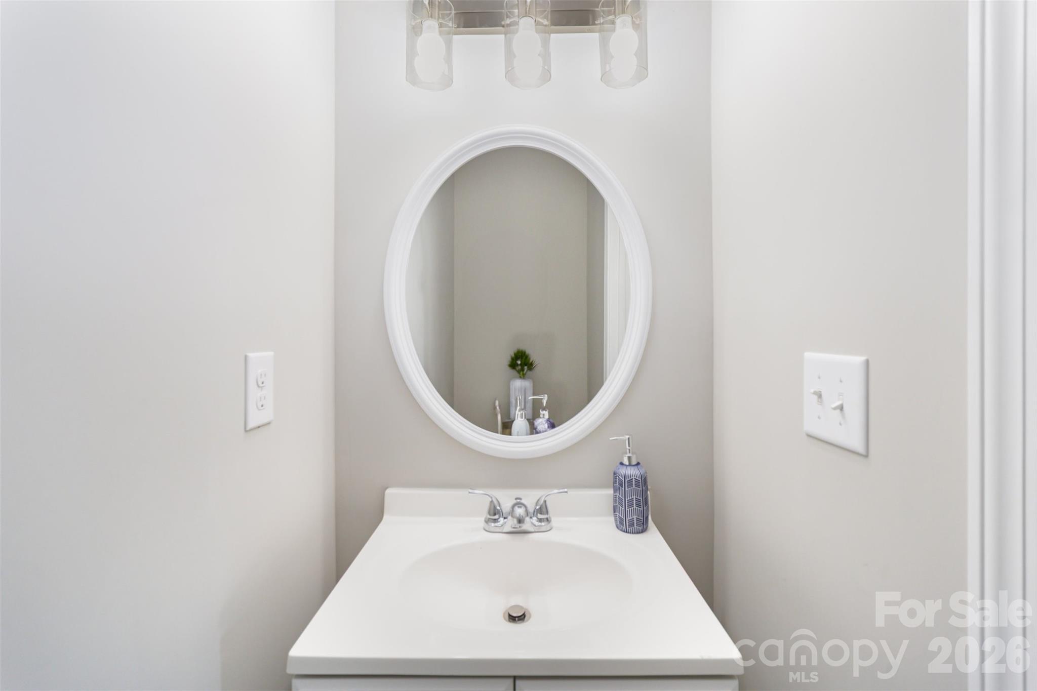 2133 Tom Sadler Road Charlotte, NC 28214 - Photo 11 of 30 a bathroom with a sink mirror and vanity