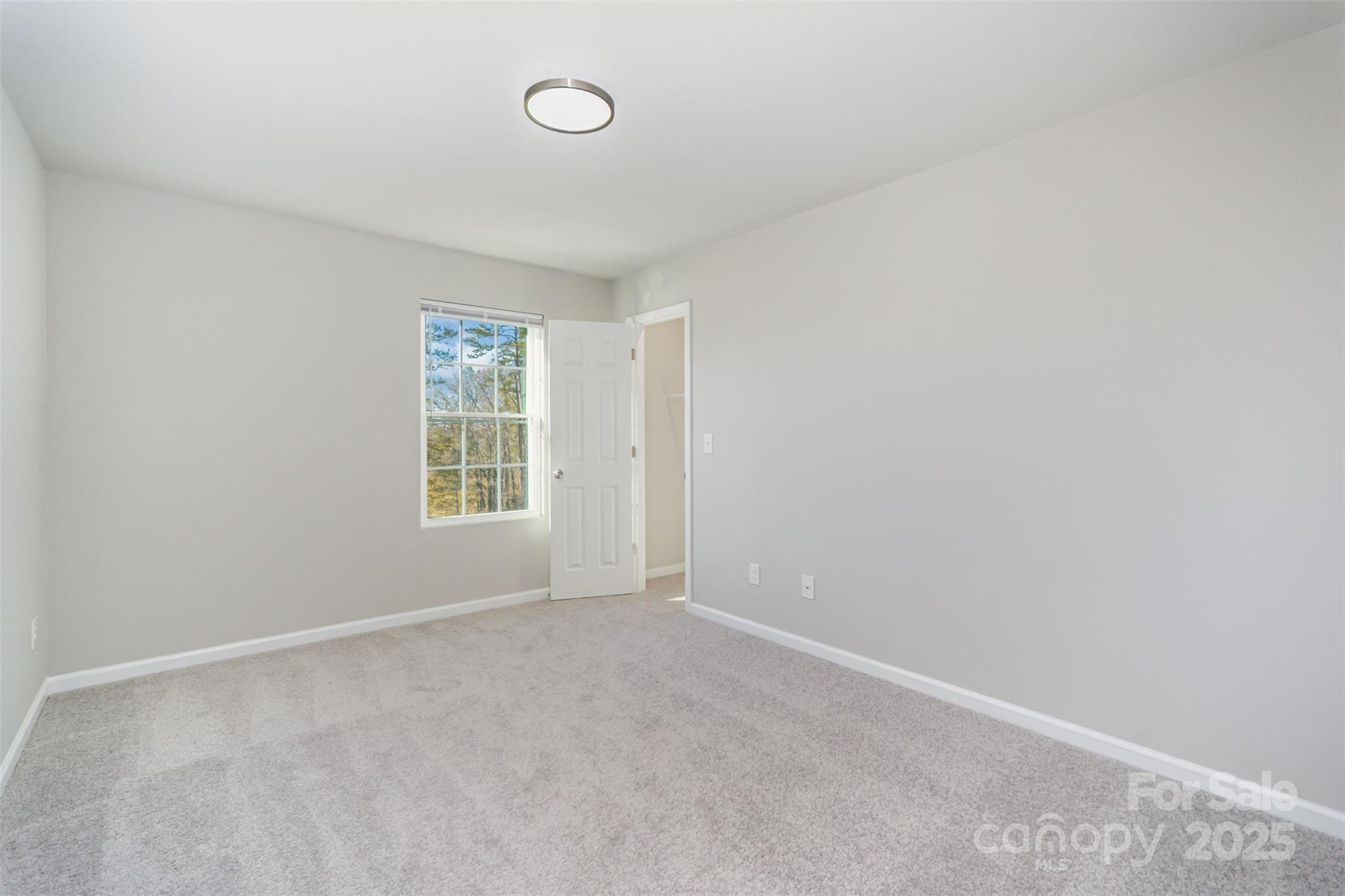 2133 Tom Sadler Road Charlotte, NC 28214 - Photo 19 of 27 an empty room with windows
