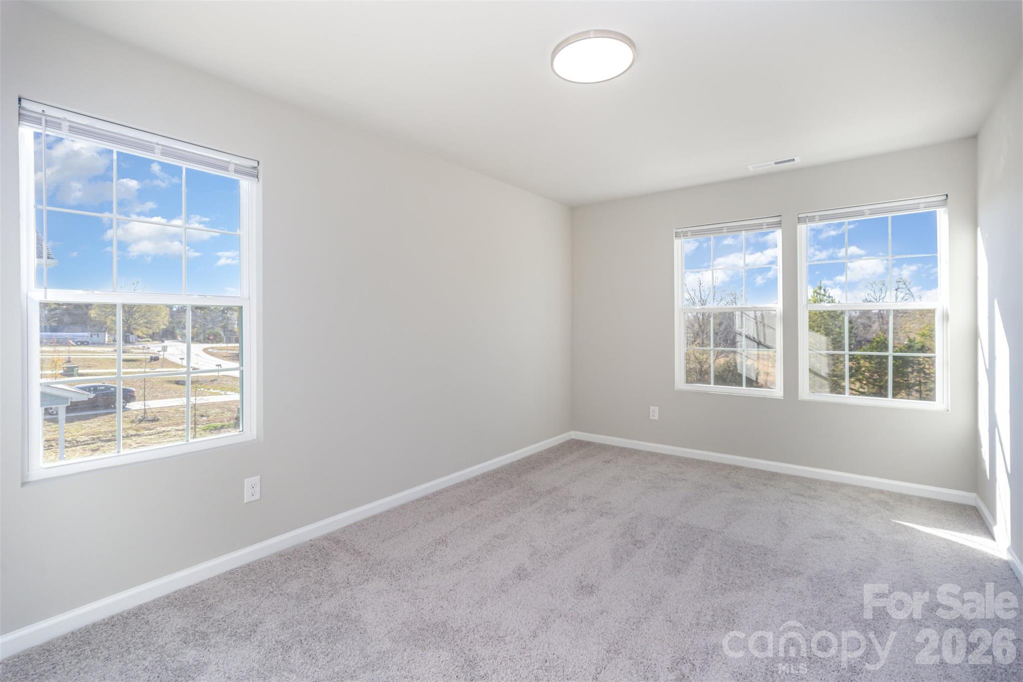 2133 Tom Sadler Road Charlotte, NC 28214 - Photo 19 of 30 an empty room with windows