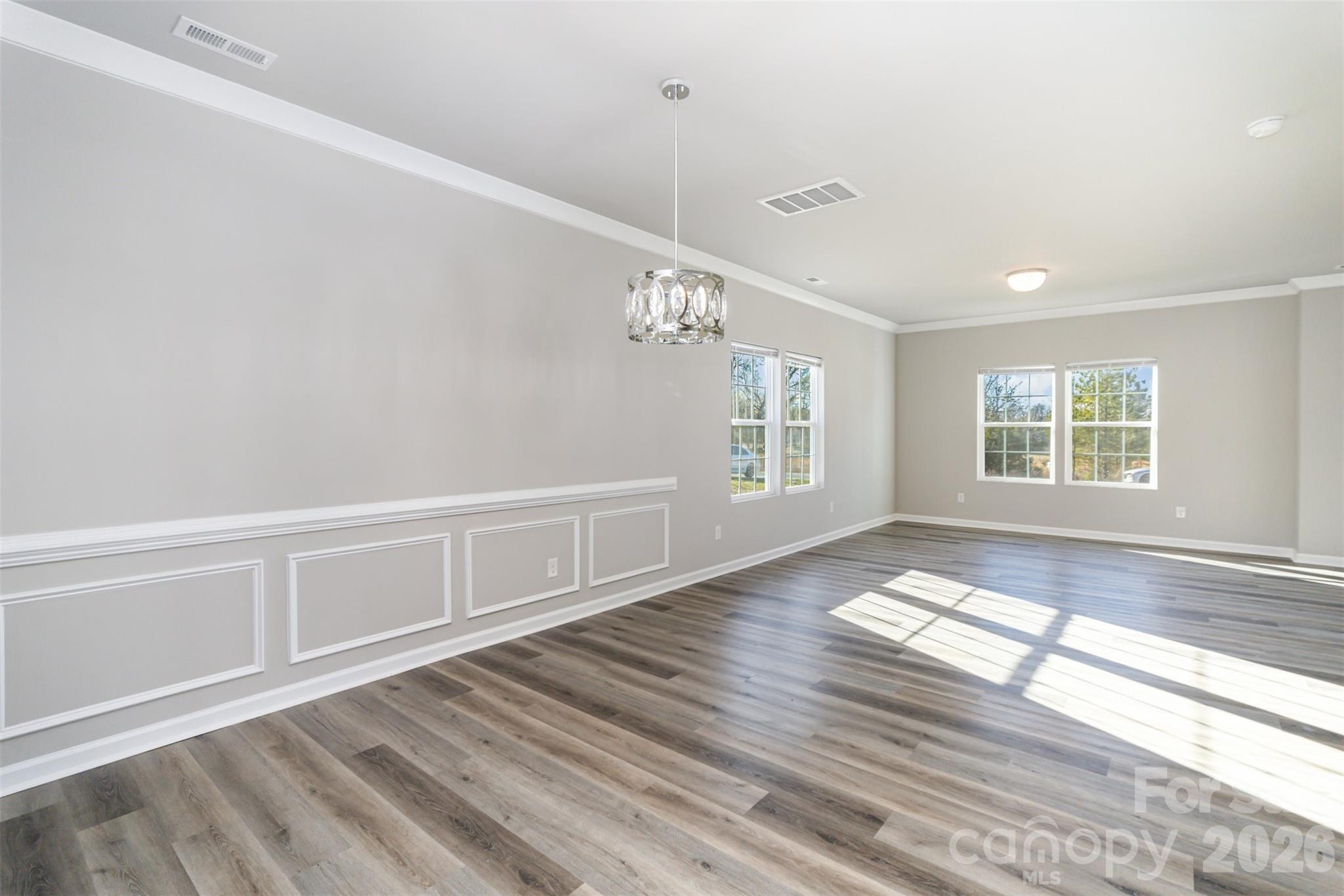 2133 Tom Sadler Road Charlotte, NC 28214 - Photo 24 of 30 a view of an empty room with a window and wooden floor