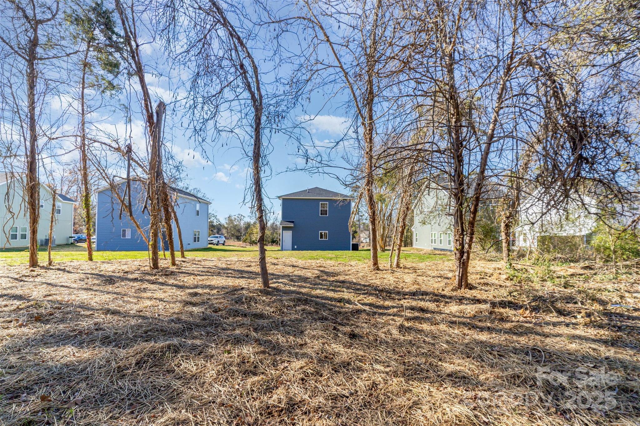 2133 Tom Sadler Road Charlotte, NC 28214 - Photo 25 of 27 a house with trees in front of it