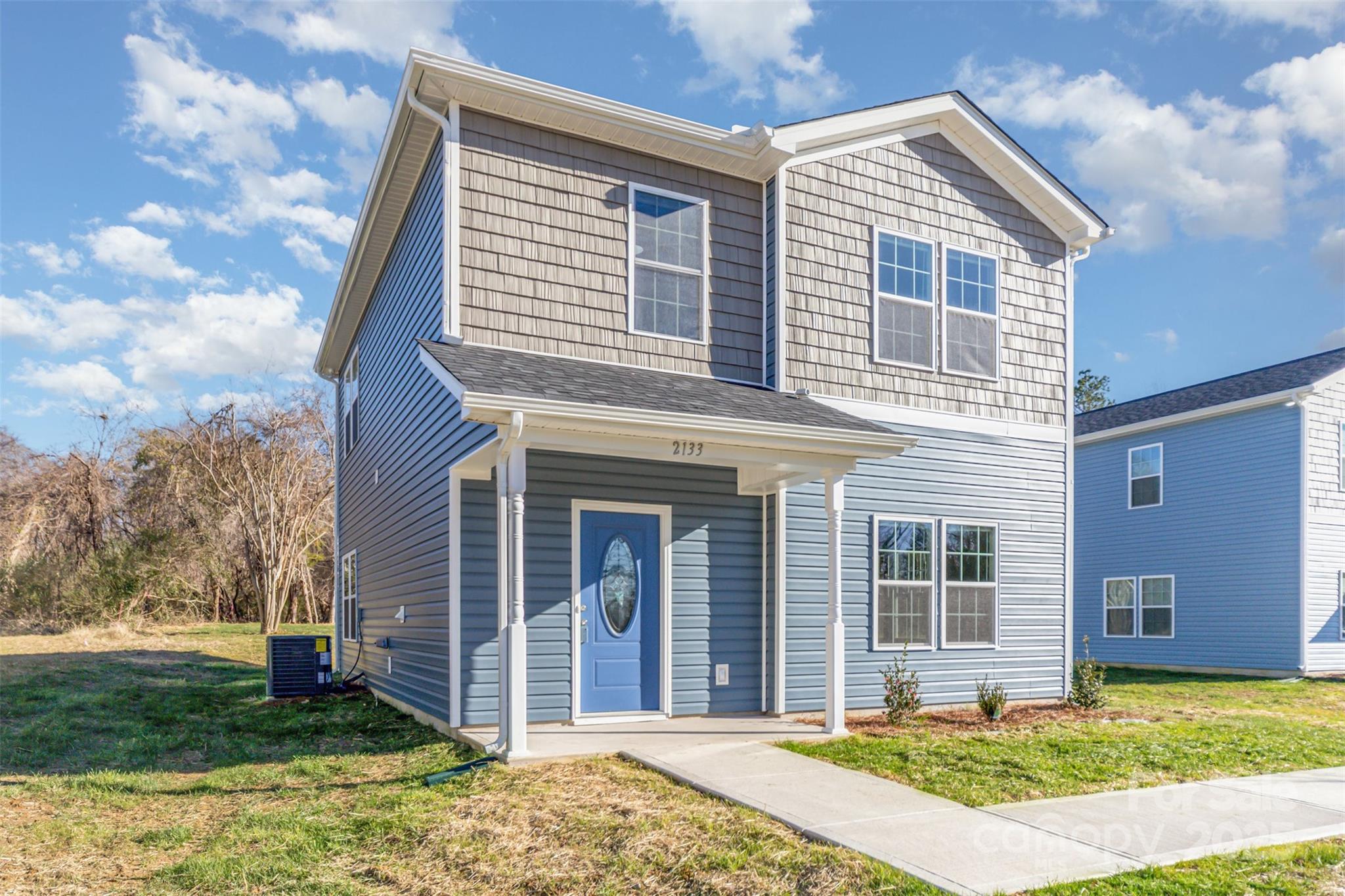 2133 Tom Sadler Road Charlotte, NC 28214 - Photo 26 of 27 a front view of a house with a yard