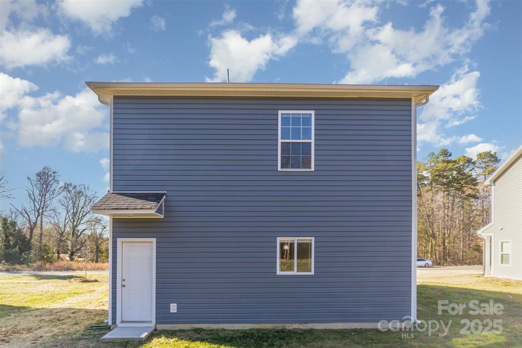 2133 Tom Sadler Road Charlotte, NC 28214 - Photo 27 of 27 a view of a brick house next to a yard