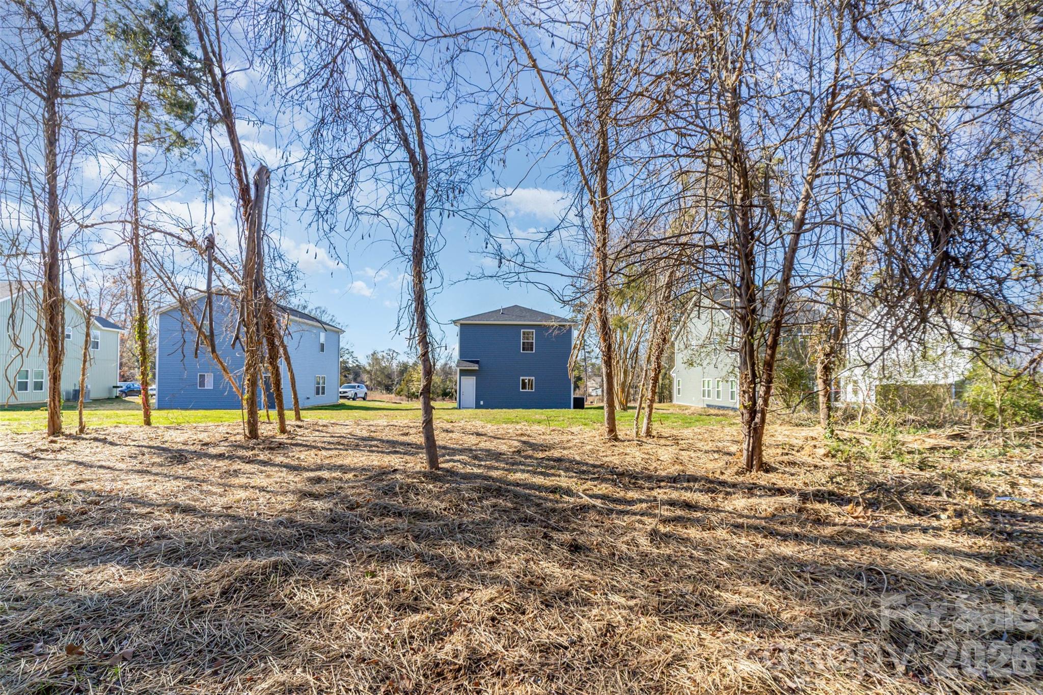 2133 Tom Sadler Road Charlotte, NC 28214 - Photo 28 of 30 a house with trees in front of it