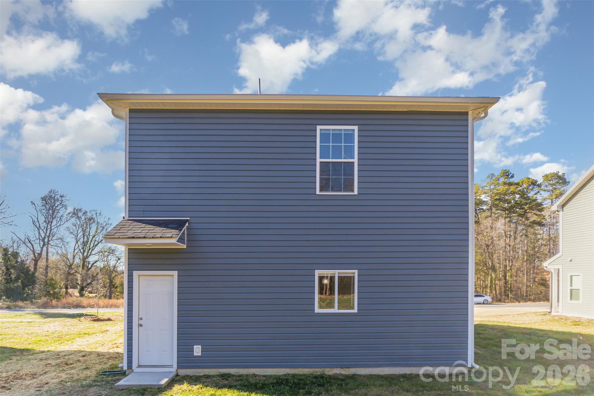 2133 Tom Sadler Road Charlotte, NC 28214 - Photo 29 of 30 a view of a brick house next to a yard