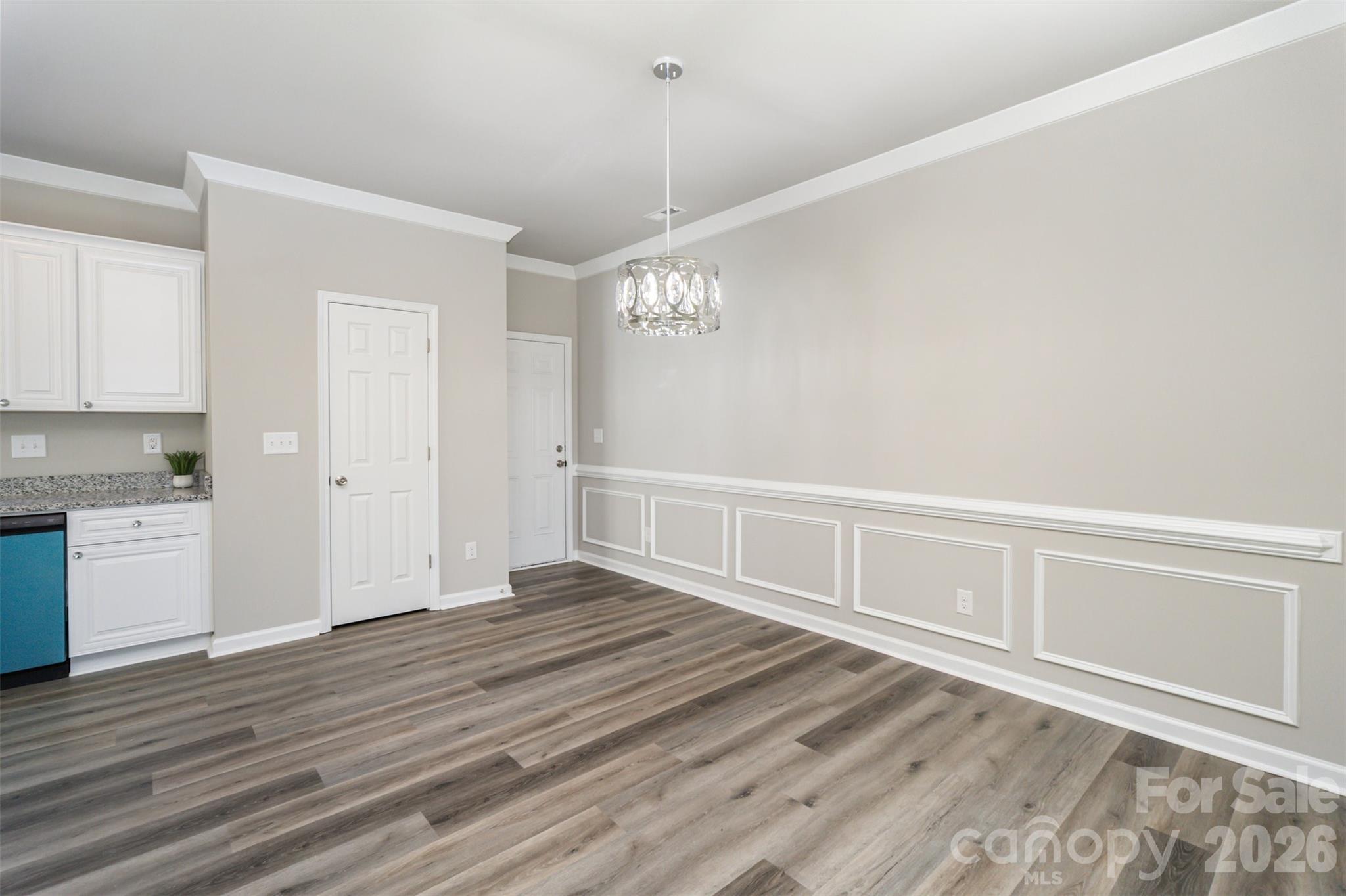 2133 Tom Sadler Road Charlotte, NC 28214 - Photo 7 of 30 a view of an empty room with wooden floor