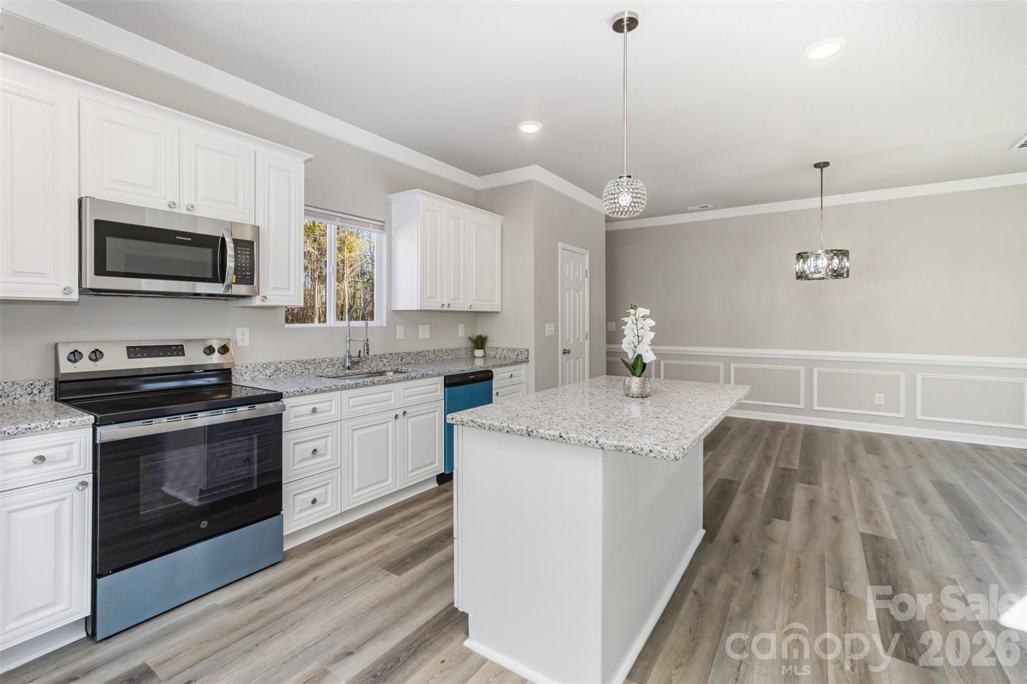 2133 Tom Sadler Road Charlotte, NC 28214 - Photo 9 of 30 a kitchen with a sink stove and microwave