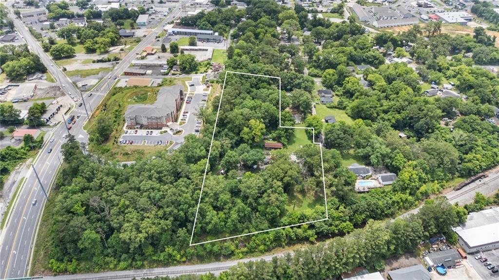 1202 Desoto Avenue Northwest Rome, GA 30165 - Photo 3 of 19 an aerial view of residential house with outdoor space and trees around