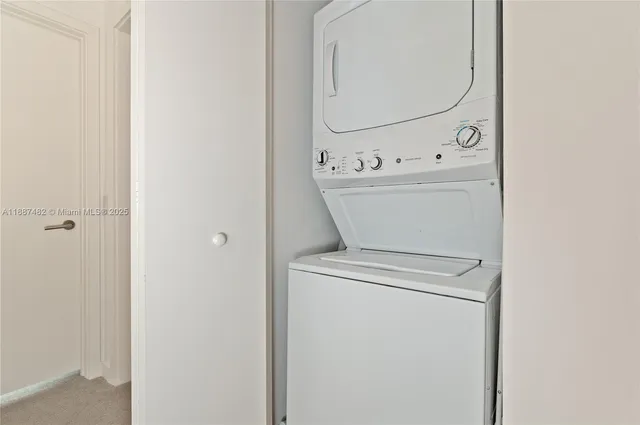 a close up view of a utility room with washer and dryer