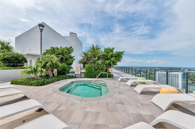 a view of swimming pool with seating space