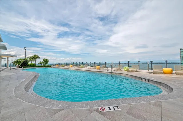 a view of a swimming pool with a terrace