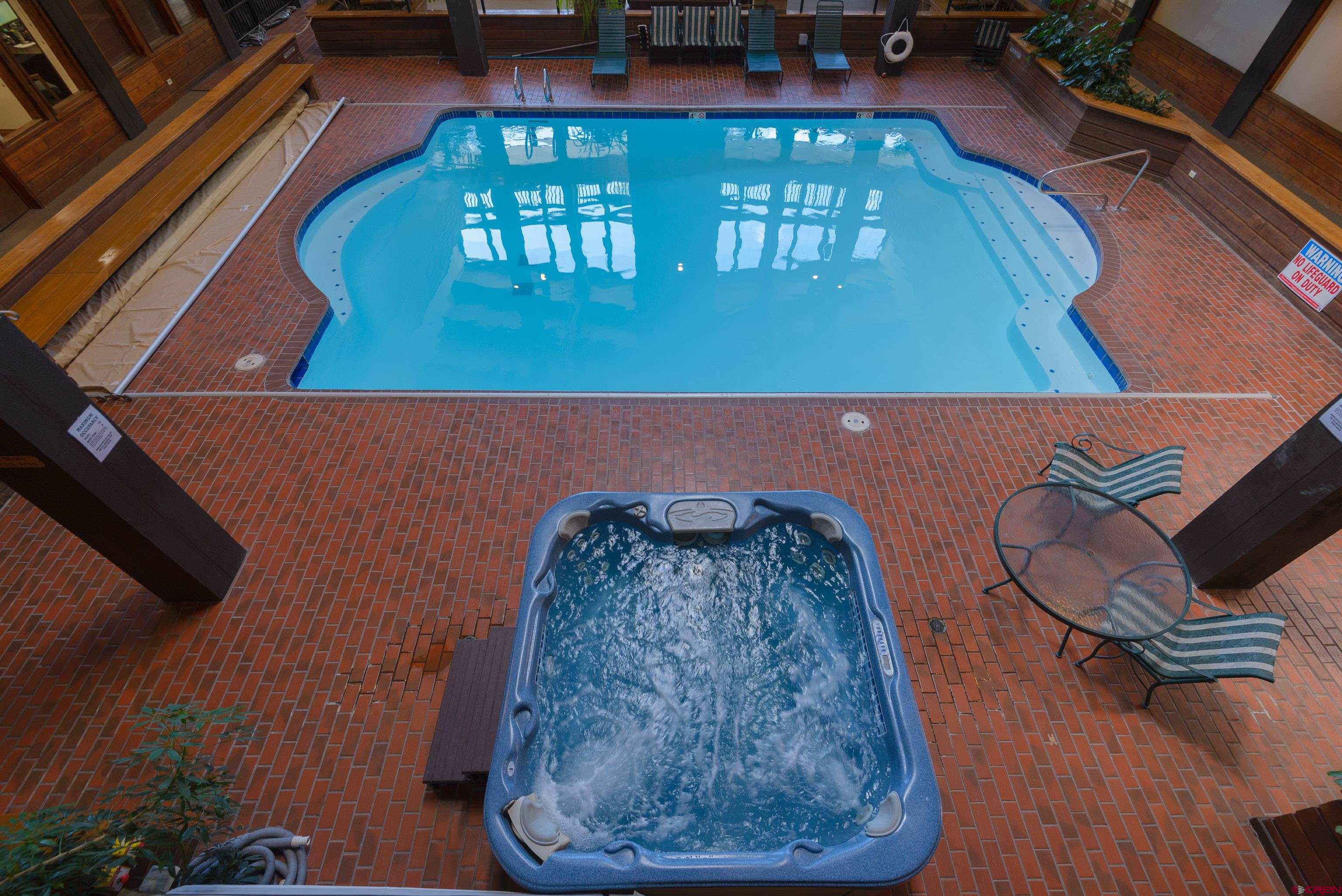 a view of a balcony with chair and table