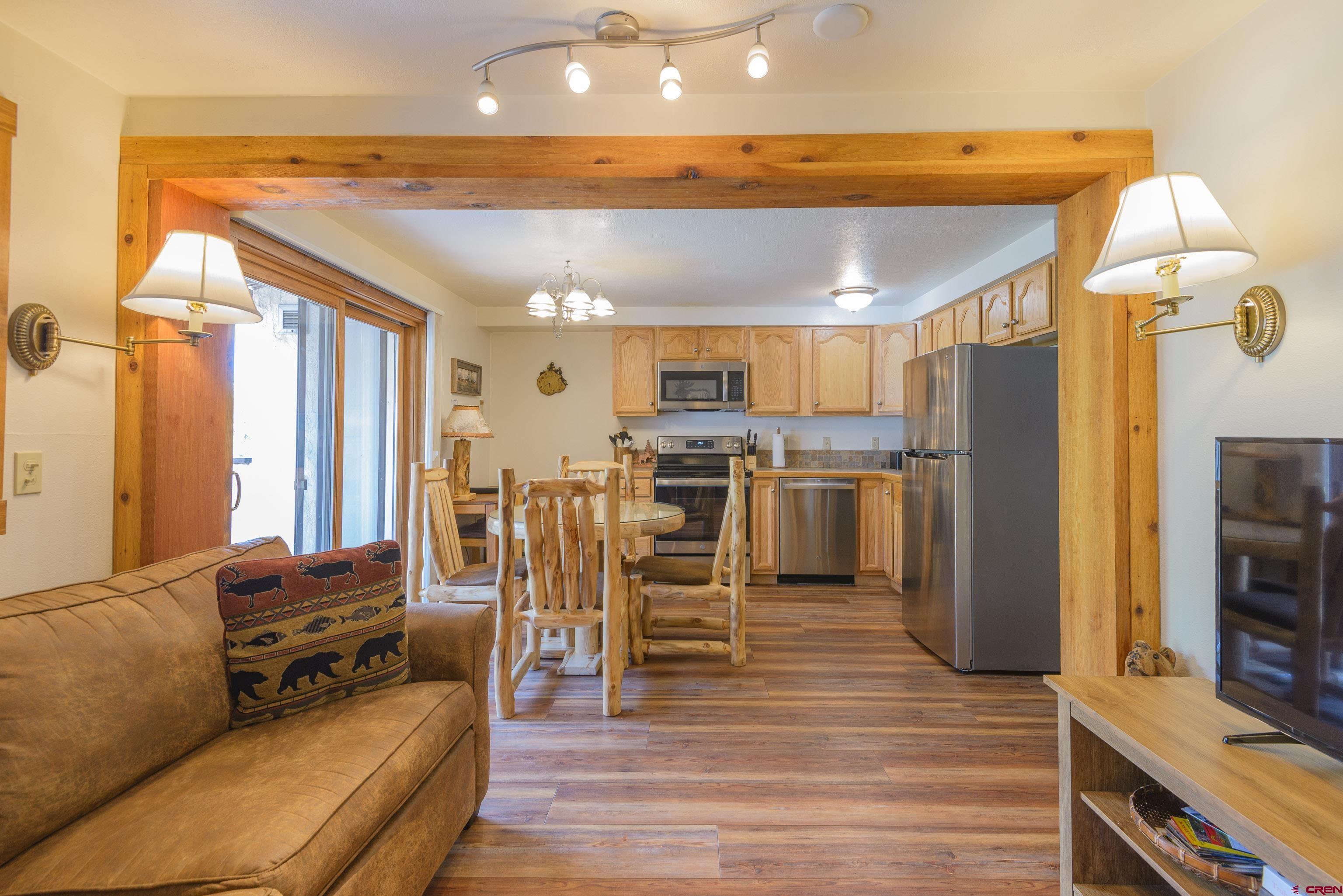 701 Gothic Road, Unit 332 Crested Butte, CO 81225 - Photo 24 of 29 a living room with stainless steel appliances furniture and a kitchen view