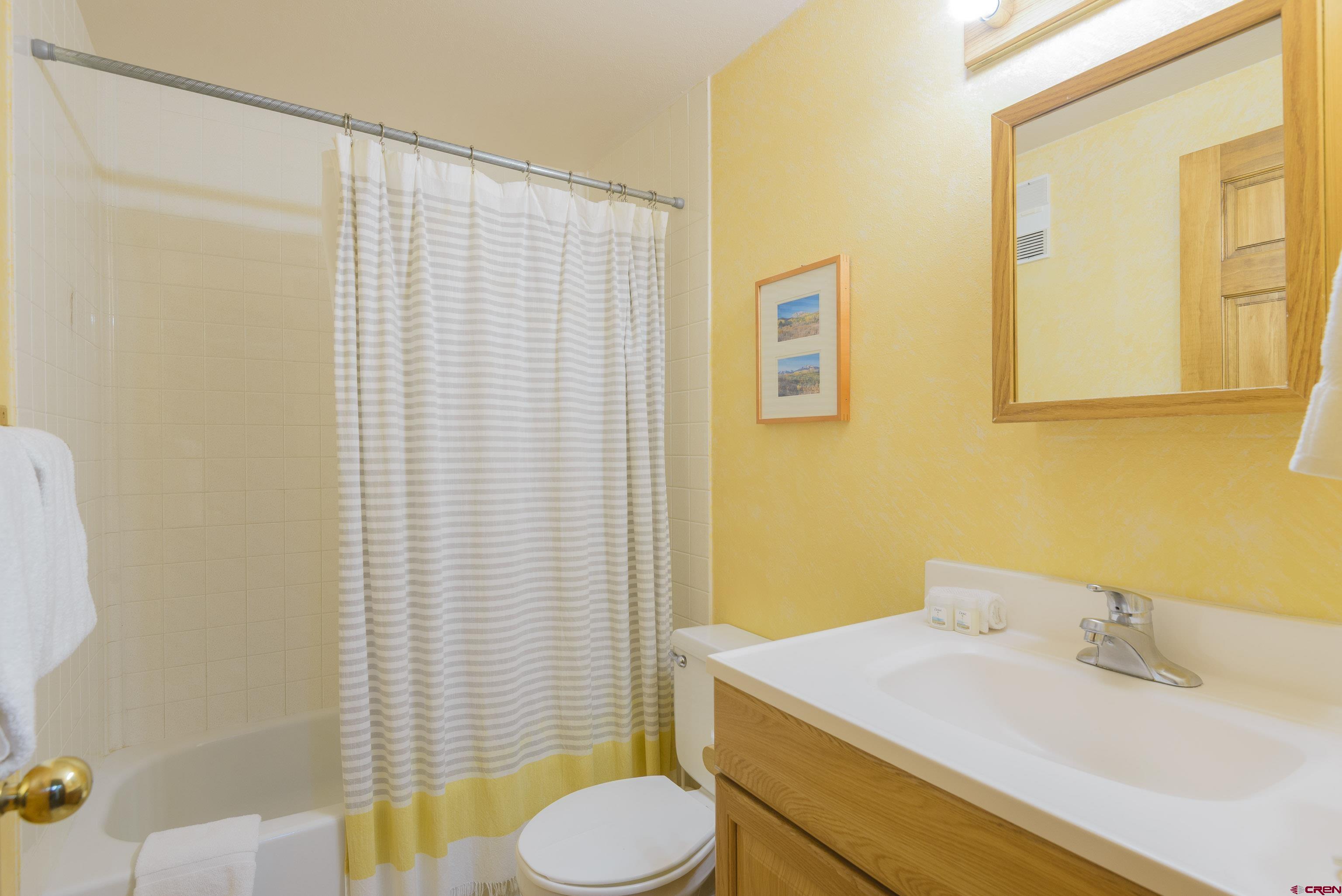 701 Gothic Road, Unit 332 Crested Butte, CO 81225 - Photo 6 of 29 a bathroom with a sink toilet and vanity