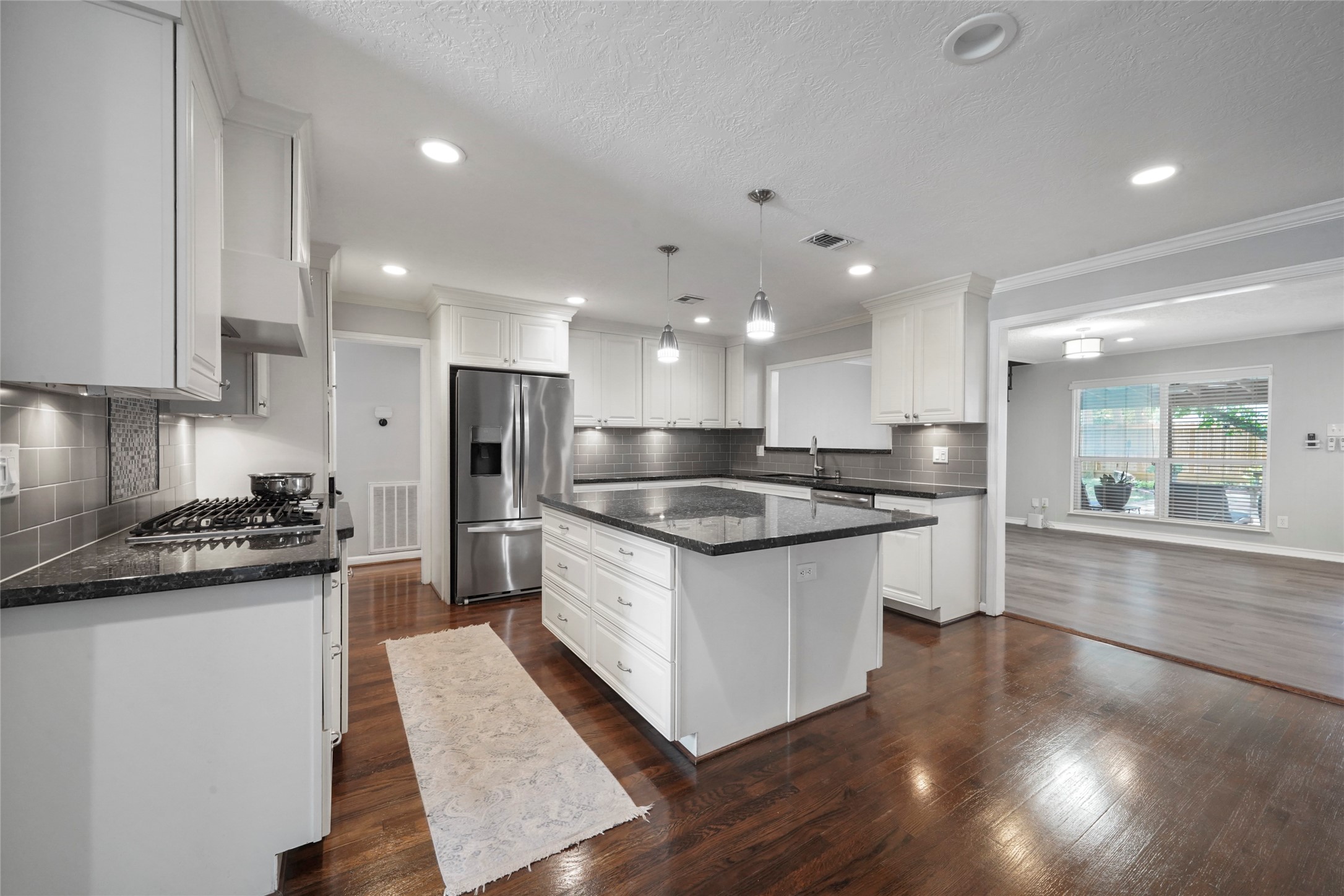1803 Libbey Drive Houston, TX 77018 - Photo 12 of 44 This custom kitchen boast a large granite island
and countertops. Stainless Steel appliances,
recessed lighting with lots of counter and cabinet
spaces.