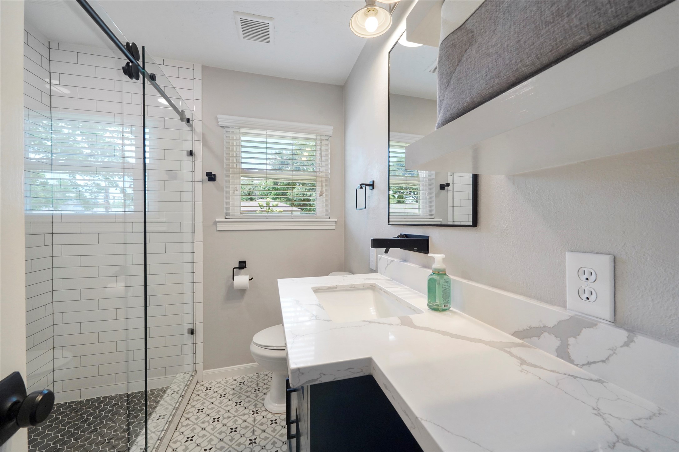 1803 Libbey Drive Houston, TX 77018 - Photo 29 of 44 Full bathroom remodeled with shower, granite
countertops, and double pane window.