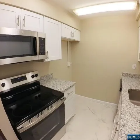 a kitchen with a stove and a microwave