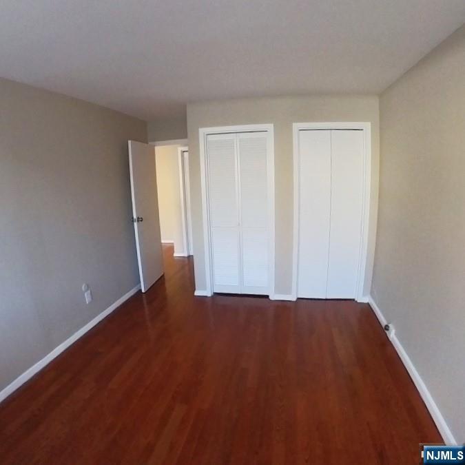 1600 Center Avenue, Unit 1D Fort Lee, NJ 07024 - Photo 10 of 10 a view of an empty room with wooden floor