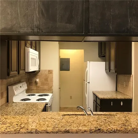a view of kitchen with wooden floor