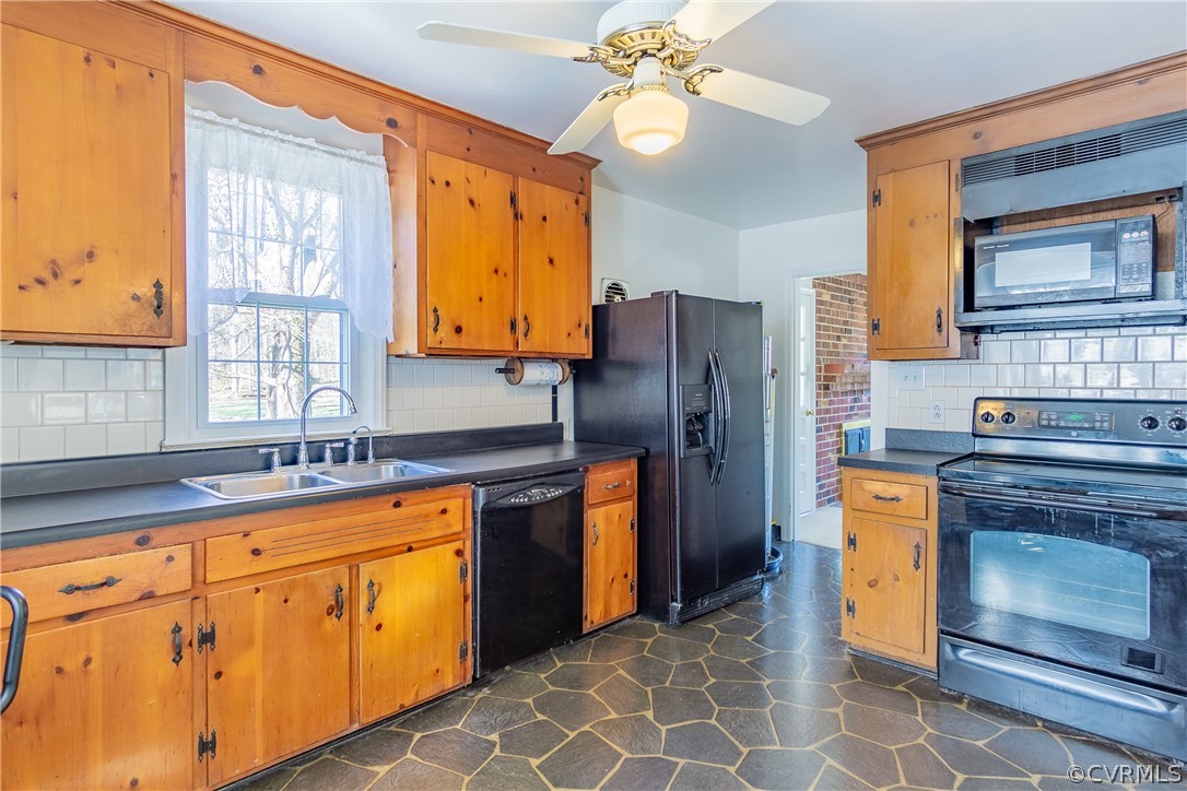 8276 Varina Road Henrico, VA 23231 - Photo 14 of 39 a kitchen with stainless steel appliances granite countertop a stove a refrigerator and a sink