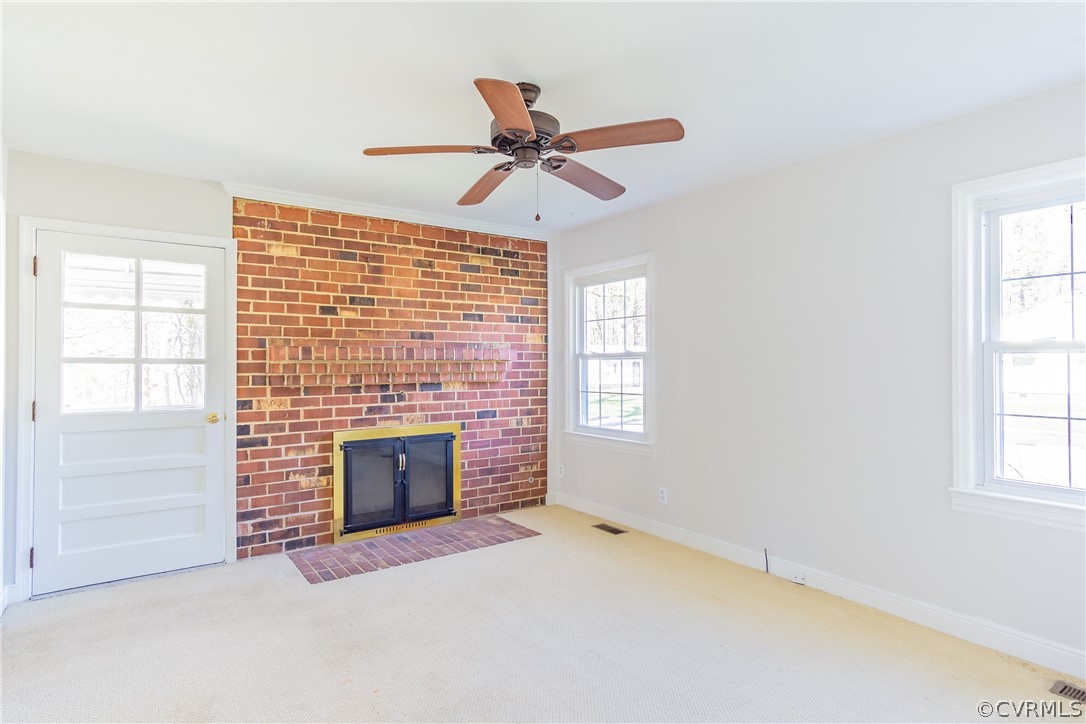 8276 Varina Road Henrico, VA 23231 - Photo 21 of 39 an empty room with windows and fireplace