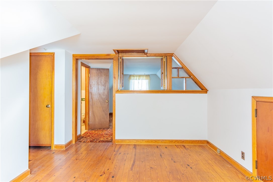 8276 Varina Road Henrico, VA 23231 - Photo 26 of 39 a view of an empty room with wooden floor and a window