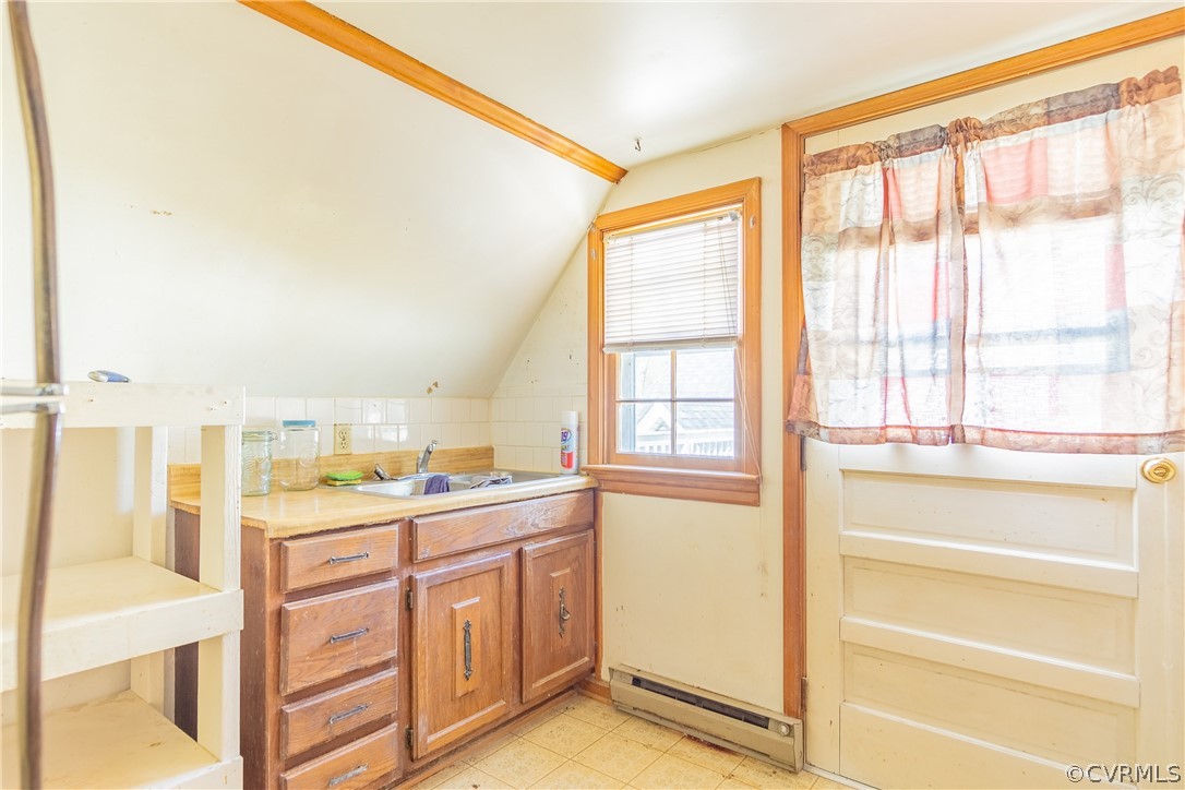 8276 Varina Road Henrico, VA 23231 - Photo 33 of 39 a kitchen with a window a sink and cabinets