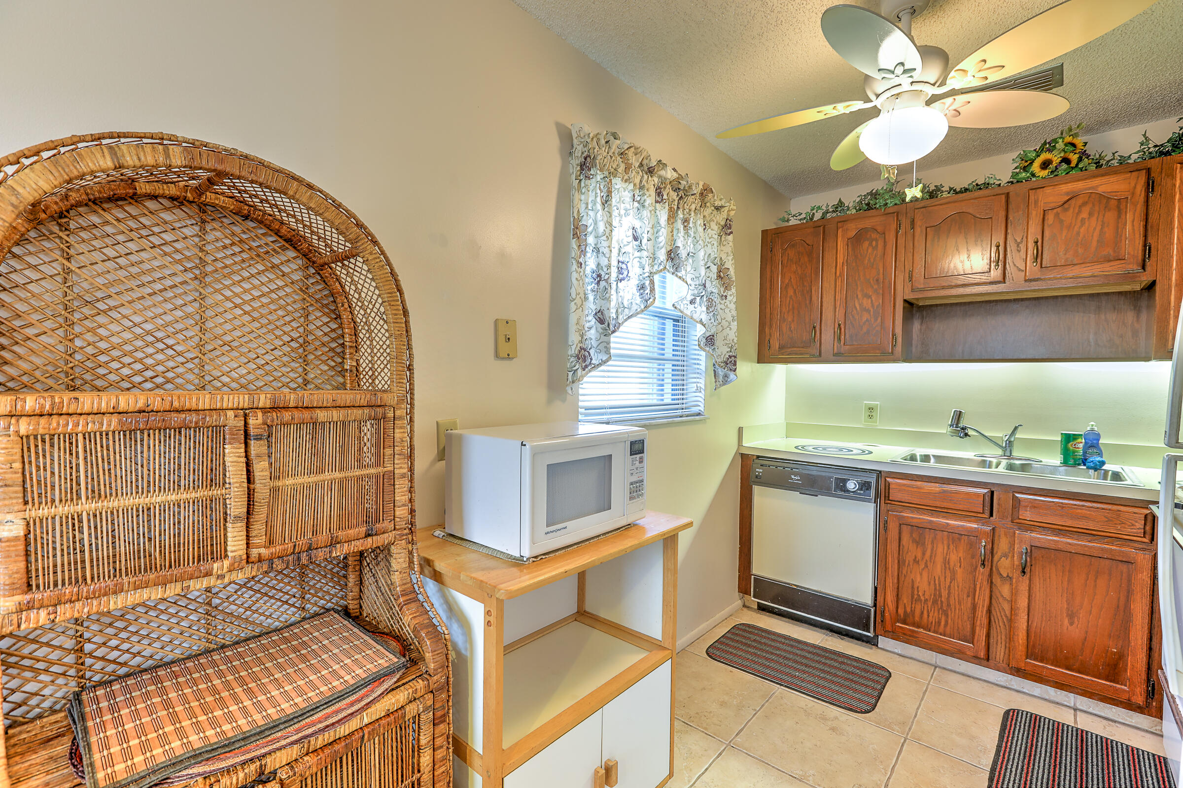 25 Lake Vista Trail, Unit 203 Port St. Lucie, FL 34952 - Photo 12 of 36 a kitchen with cabinets and window