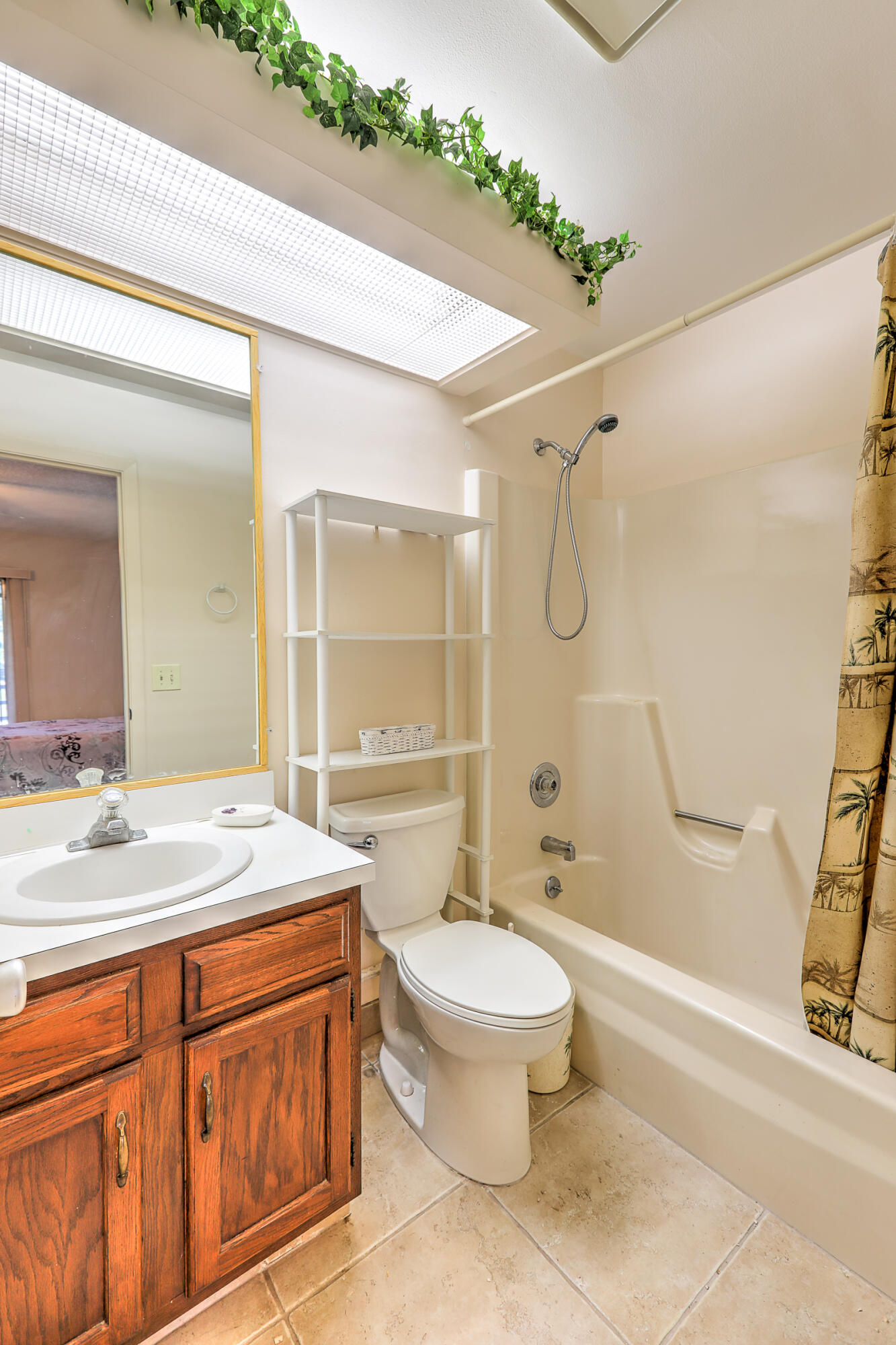 25 Lake Vista Trail, Unit 203 Port St. Lucie, FL 34952 - Photo 20 of 36 a bathroom with a granite countertop sink toilet and shower