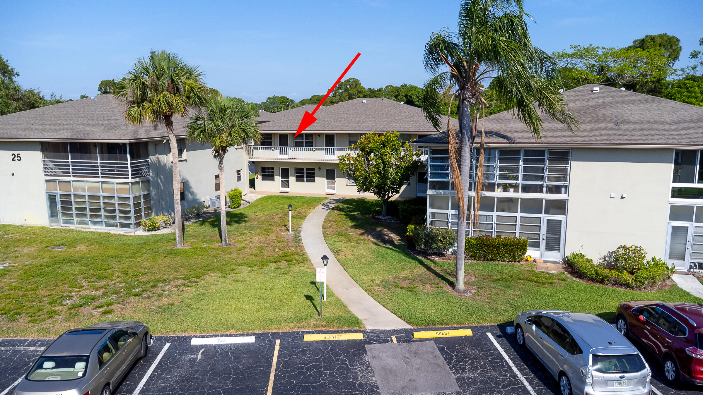 25 Lake Vista Trail, Unit 203 Port St. Lucie, FL 34952 - Photo 2 of 36 a view of a house with backyard swimming pool and sitting area