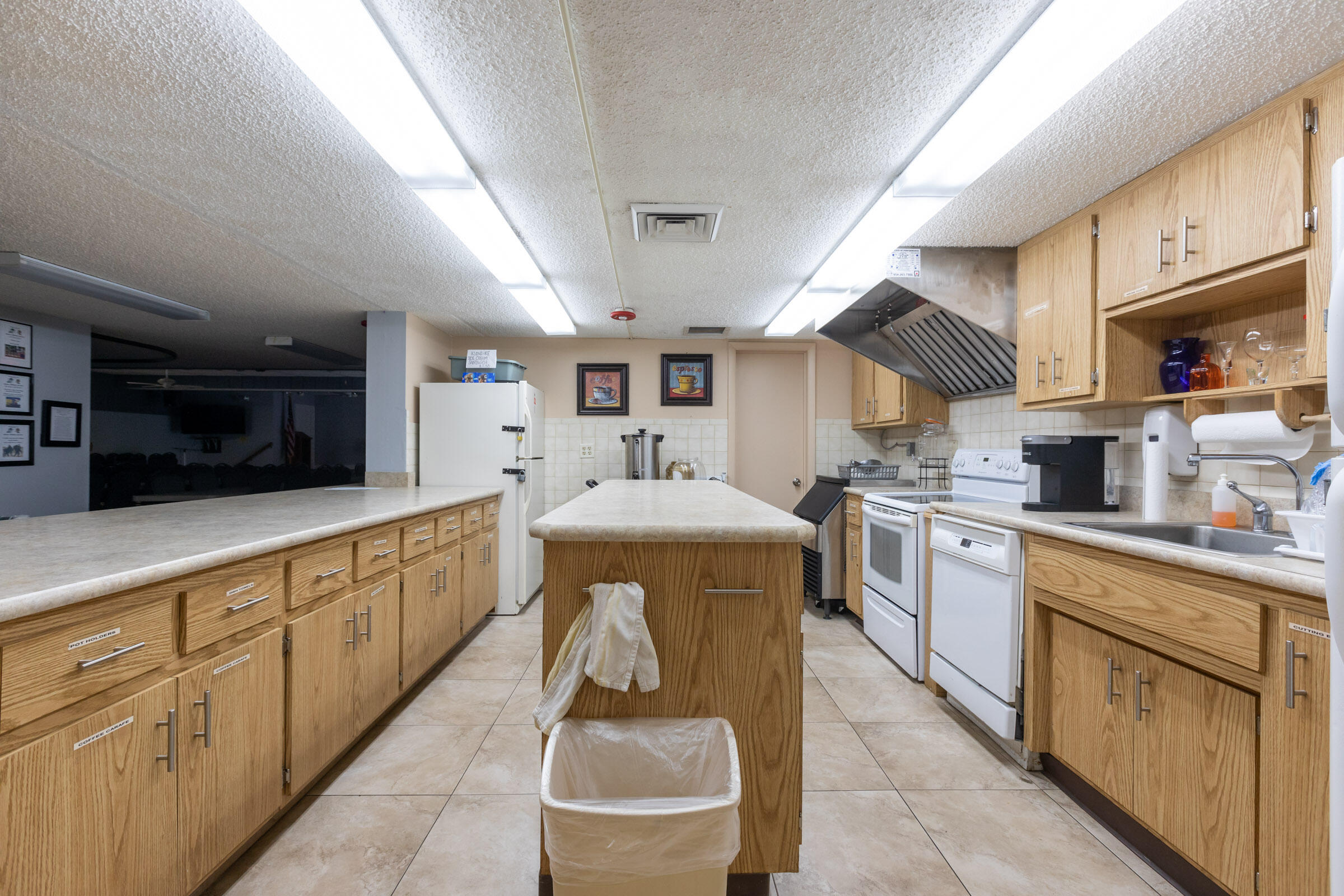 25 Lake Vista Trail, Unit 203 Port St. Lucie, FL 34952 - Photo 33 of 36 a kitchen with sink cabinets and window
