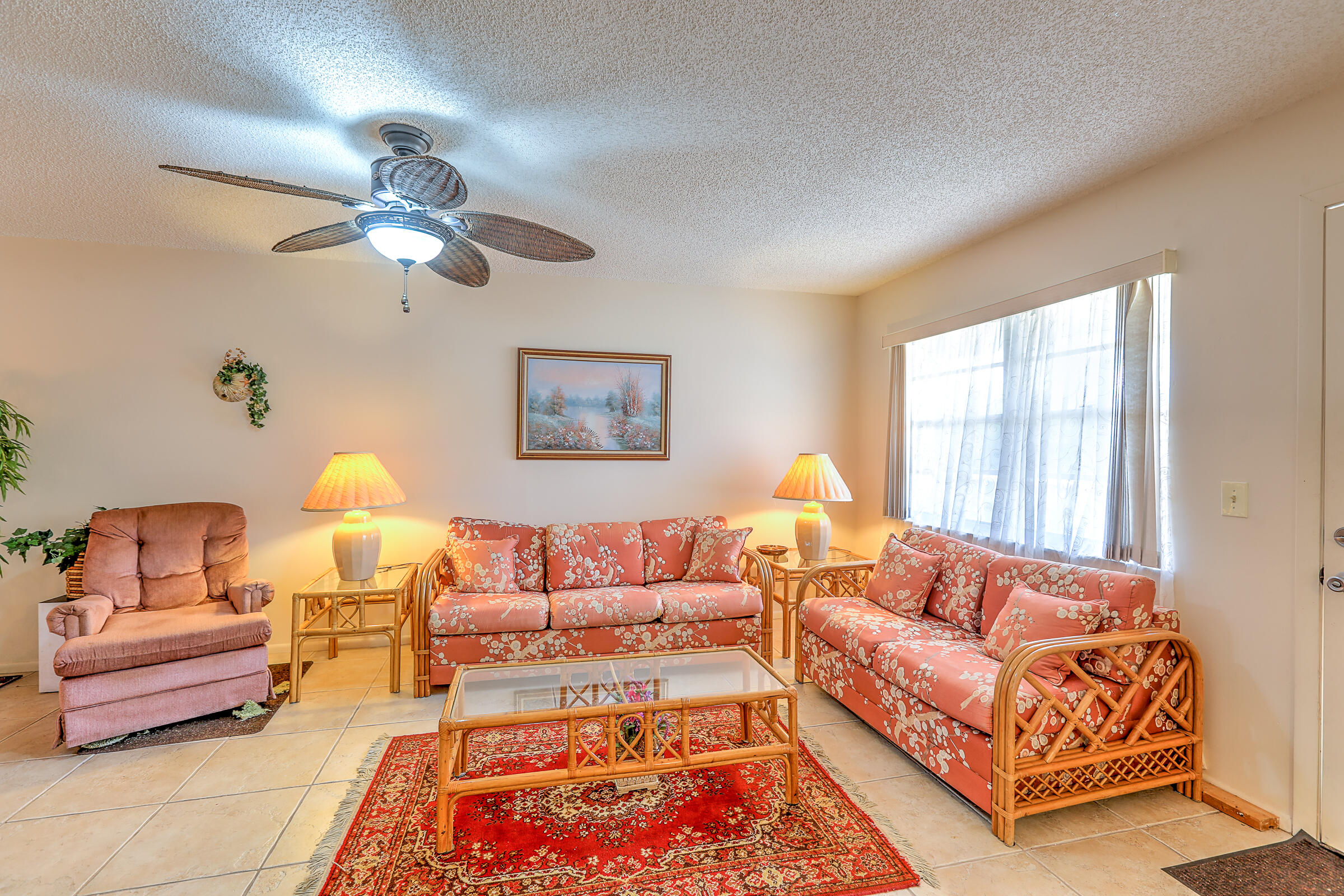 25 Lake Vista Trail, Unit 203 Port St. Lucie, FL 34952 - Photo 7 of 36 a living room with furniture and a window