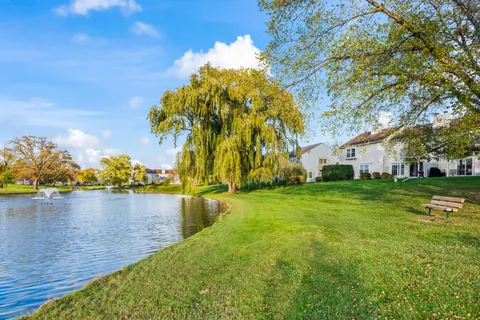 a view of a lake with a house in the background