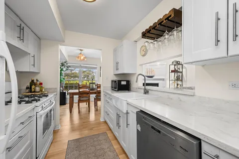 a kitchen with cabinets and appliances