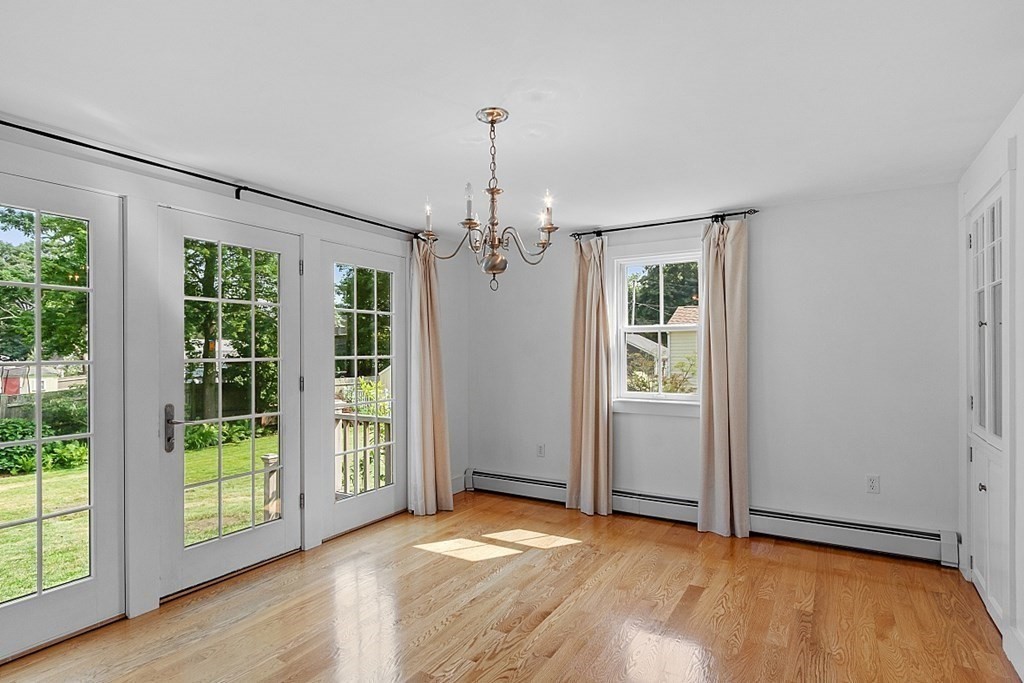 21 Cottage Street Hamilton, MA 01982 - Photo 12 of 40 a view of an empty room with glass door and a window