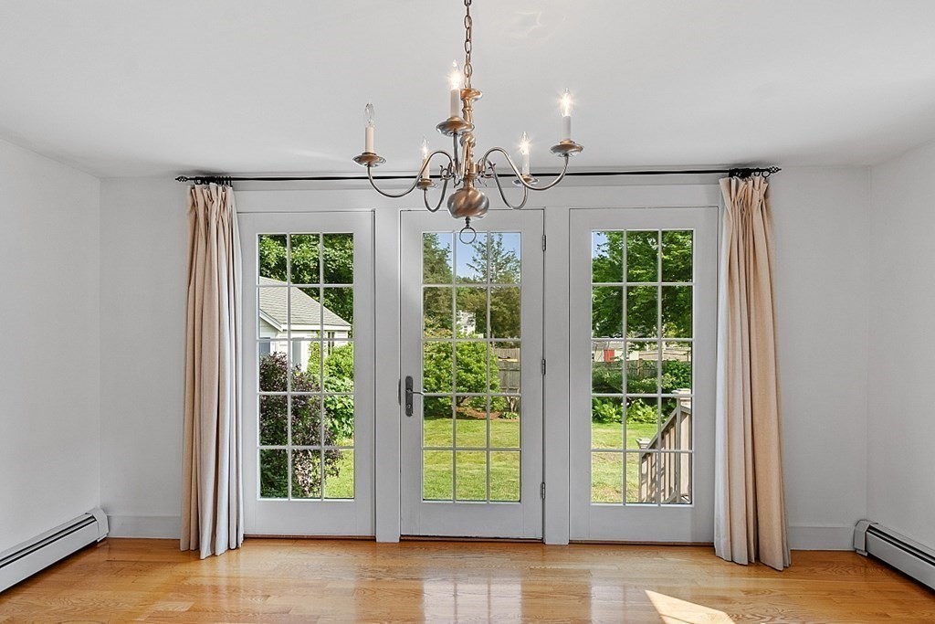 21 Cottage Street Hamilton, MA 01982 - Photo 14 of 40 a view of a room with wooden floor and windows