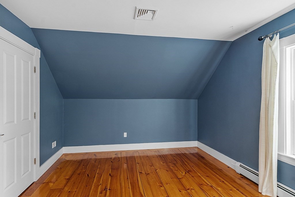 21 Cottage Street Hamilton, MA 01982 - Photo 19 of 40 a view of a room with wooden floor and white walls