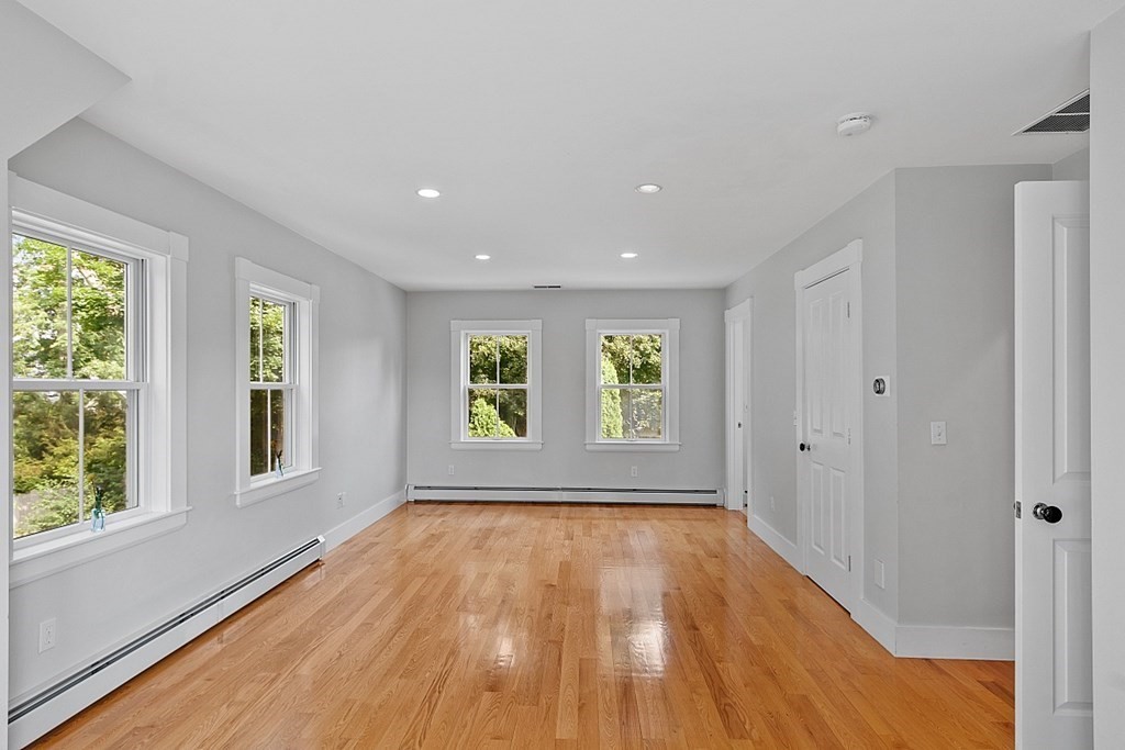 21 Cottage Street Hamilton, MA 01982 - Photo 29 of 40 a view of an empty room with wooden floor and windows
