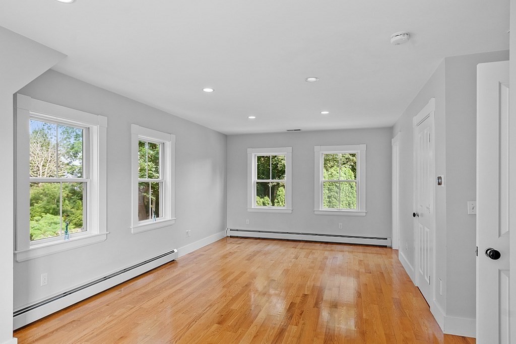 21 Cottage Street Hamilton, MA 01982 - Photo 30 of 40 an empty room with wooden floor and windows