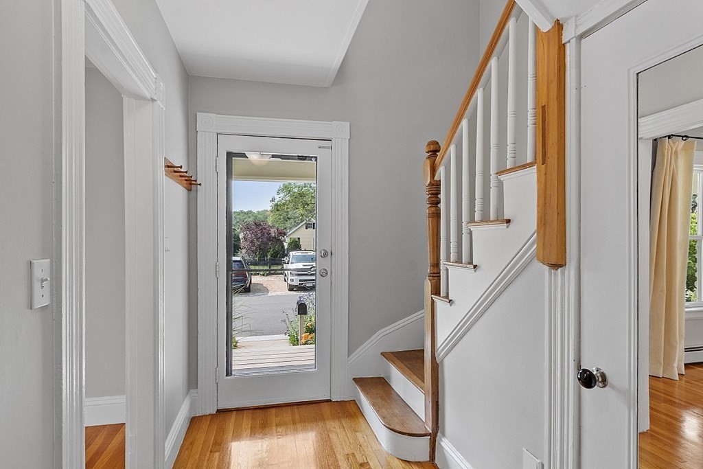 21 Cottage Street Hamilton, MA 01982 - Photo 3 of 40 a view of an entryway with a floor to ceiling window and interior