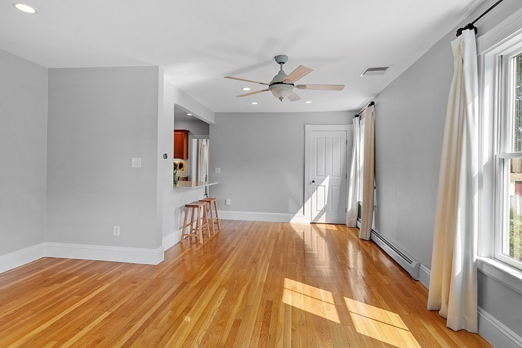 21 Cottage Street Hamilton, MA 01982 - Photo 8 of 40 a view of empty room with wooden floor and fan