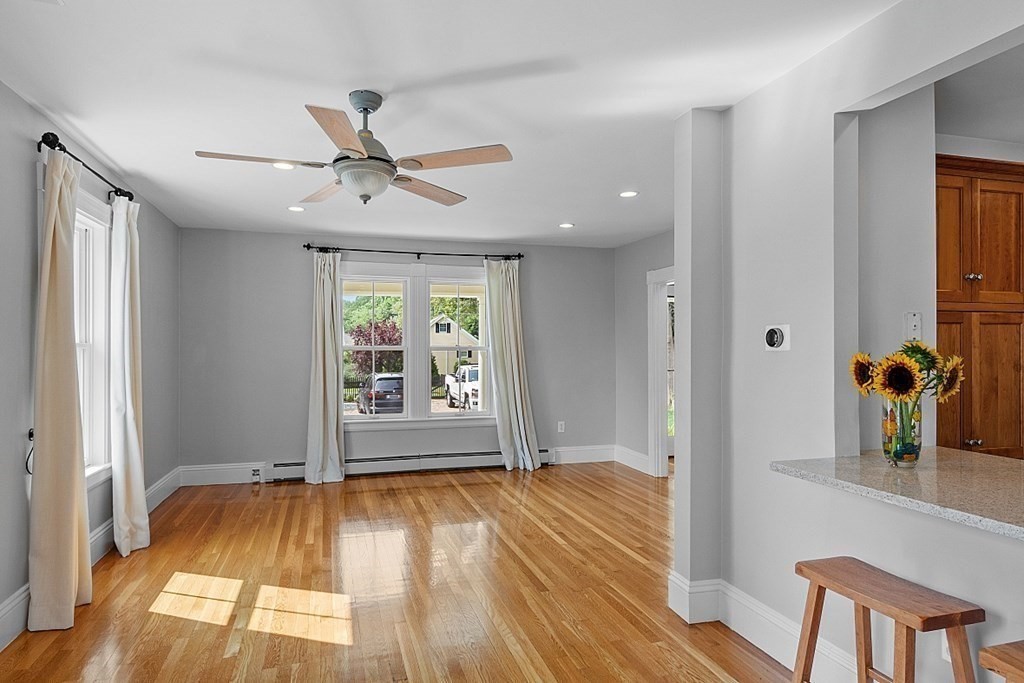 21 Cottage Street Hamilton, MA 01982 - Photo 9 of 40 a view of an empty room with window and wooden floor