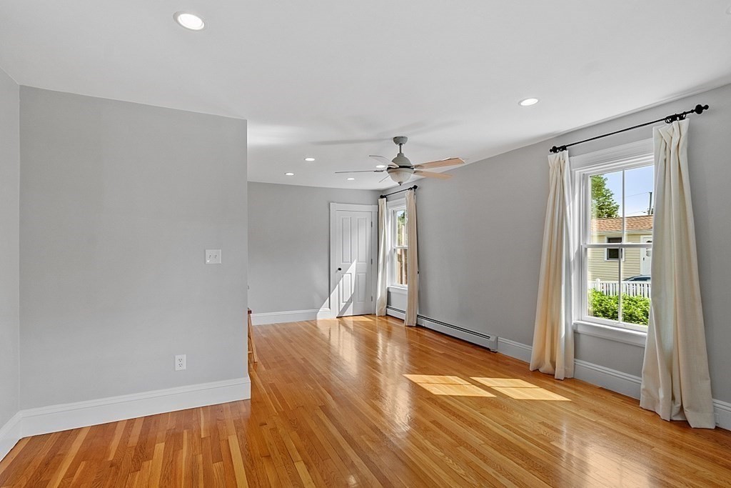 21 Cottage Street Hamilton, MA 01982 - Photo 10 of 40 a view of a big room with wooden floor and windows